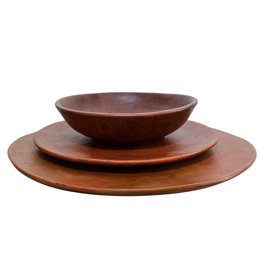 Handcrafted by skilled artisans, this exquisite set features a stunning black clay crockery ensemble. Complete with a base plate, regular plate, and a bowl, it combines timeless elegance with the rustic charm of handcrafted clay.